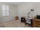 Bright bedroom with plantation shutters and a desk area with a white chair at 307 Gladstone Dr, Mcdonough, GA 30253