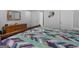 Brightly lit bedroom features a large, comfortable bed, wood furniture, neutral walls, and multiple closets at 307 Gladstone Dr, Mcdonough, GA 30253