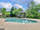 Refreshing community pool area featuring lush greenery, a gazebo, and a serene atmosphere for relaxation at 307 Gladstone Dr, Mcdonough, GA 30253