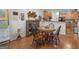 Warm dining area featuring hardwood floors, a round table with seating, and decorative wall accents at 307 Gladstone Dr, Mcdonough, GA 30253