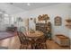 Inviting dining area with a round wooden table, hardwood floors, and decorative plates on the wall at 307 Gladstone Dr, Mcdonough, GA 30253