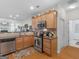Charming kitchen with stainless steel appliances, granite countertops, and views into the living area at 307 Gladstone Dr, Mcdonough, GA 30253