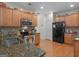Well-equipped kitchen with granite countertops, stainless steel appliances, and hardwood floors at 307 Gladstone Dr, Mcdonough, GA 30253