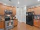 Modern kitchen featuring stainless steel appliances, granite countertops, and ample cabinet space at 307 Gladstone Dr, Mcdonough, GA 30253