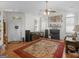 Inviting living room featuring a fireplace, hardwood floors, and a comfortable seating area at 307 Gladstone Dr, Mcdonough, GA 30253