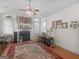 Inviting living room featuring a fireplace, hardwood floors, and a comfortable seating area at 307 Gladstone Dr, Mcdonough, GA 30253