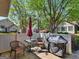 Cozy patio area with outdoor furniture, a grill, and a privacy fence, perfect for relaxation and entertaining at 307 Gladstone Dr, Mcdonough, GA 30253