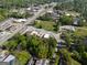 A captivating aerial view showcases this property near roads, buildings, and a railroad at 174 E Broad St, Fairburn, GA 30213