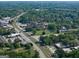 A captivating aerial view showcases this property near roads, buildings, and a railroad at 174 E Broad St, Fairburn, GA 30213