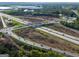 A stunning aerial view captures this property's ideal location near roads and surrounding trees at 174 E Broad St, Fairburn, GA 30213