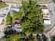 An aerial view showcasing this property's position next to parking, trees, roads, and buildings at 174 E Broad St, Fairburn, GA 30213
