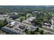An aerial view showcasing the property's location with nearby roads, commercial buildings, and residential area at 174 E Broad St, Fairburn, GA 30213