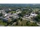 An aerial view showcasing the property's location with nearby roads, commercial buildings, and residential area at 174 E Broad St, Fairburn, GA 30213