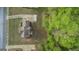 Aerial view of a well-maintained home with mature landscaping and a spacious backyard abutting a wooded area at 225 Briarsweet Way, Fayetteville, GA 30215
