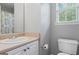 Bright bathroom features a single sink vanity with a beige countertop and a shower-tub combo at 225 Briarsweet Way, Fayetteville, GA 30215