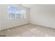 Bright bedroom with neutral carpet and a large window at 225 Briarsweet Way, Fayetteville, GA 30215