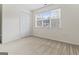 Bedroom features a closet and a bright window at 225 Briarsweet Way, Fayetteville, GA 30215