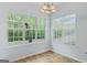 Dining room features a large window and chandelier lighting at 225 Briarsweet Way, Fayetteville, GA 30215