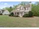 View of the property's front exterior, showing the lawn and surrounding landscape at 225 Briarsweet Way, Fayetteville, GA 30215
