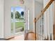 Inviting foyer with hardwood floors, a staircase, and plenty of natural light streaming through the front door at 225 Briarsweet Way, Fayetteville, GA 30215