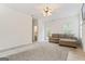 Large living room with a fireplace, a ceiling fan, and access to a backyard patio at 225 Briarsweet Way, Fayetteville, GA 30215