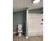 Updated bathroom with new white tub and toilet, and a rain-style shower head at 116 Stewart Ave, Jonesboro, GA 30236