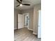 Neutral bedroom with modern ceiling fan, gray walls and wood-look floors at 116 Stewart Ave, Jonesboro, GA 30236