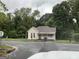 Charming single-story home with a welcoming front porch and well-maintained lawn on a cloudy day at 116 Stewart Ave, Jonesboro, GA 30236