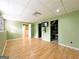 Finished basement with hardwood floors, natural light, and access to additional storage at 3195 Vickery Ne Dr, Marietta, GA 30066