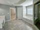 Elegant bathroom showcasing a large tub, tile floors, and natural light from a window at 3195 Vickery Ne Dr, Marietta, GA 30066