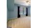 Cozy bedroom with a window and blinds, carpeted floor, and blue walls at 3195 Vickery Ne Dr, Marietta, GA 30066