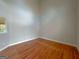 Clean bedroom with hardwood floors, neutral paint, and a large window with natural light at 3195 Vickery Ne Dr, Marietta, GA 30066