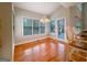 Bright dining area with a view of a deck, hardwood flooring, and vaulted ceiling at 3195 Vickery Ne Dr, Marietta, GA 30066