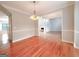 Dining room with hardwood floors leading to an open-concept layout and natural light at 3195 Vickery Ne Dr, Marietta, GA 30066