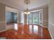 Elegant dining room with hardwood floors, bay window, and decorative ceiling medallion at 3195 Vickery Ne Dr, Marietta, GA 30066