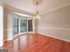 Bright dining room featuring hardwood floors, chair rail detail, and a large bay window at 3195 Vickery Ne Dr, Marietta, GA 30066
