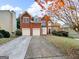 Charming brick two-story home with attached two car garage and well-manicured front yard at 3195 Vickery Ne Dr, Marietta, GA 30066