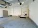 Spacious garage with overhead lighting and ample storage space, perfect for vehicles and projects at 3195 Vickery Ne Dr, Marietta, GA 30066