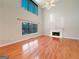 Bright living room with hardwood floors, large windows, a ceiling fan, and a fireplace at 3195 Vickery Ne Dr, Marietta, GA 30066