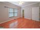 Bright main bedroom with hardwood floors, a window, closet access, and neutral paint at 3195 Vickery Ne Dr, Marietta, GA 30066