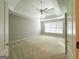 Spacious main bedroom featuring tray ceiling, fan, and large windows for natural light at 3195 Vickery Ne Dr, Marietta, GA 30066
