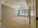 Main bedroom featuring a tray ceiling, ceiling fan and large windows at 3195 Vickery Ne Dr, Marietta, GA 30066