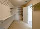 Spacious walk-in closet with shelving, carpeted floor, and an open doorway at 3195 Vickery Ne Dr, Marietta, GA 30066