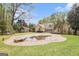 Spacious backyard featuring a large, in-ground pool and manicured lawn with trees and home at 110 Kylemore Pass, Tyrone, GA 30290