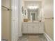 Full bathroom with ample storage, neutral paint and a large mirror at 110 Kylemore Pass, Tyrone, GA 30290