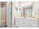 Traditional bathroom design featuring a white vanity with a large mirror and a shower/tub combination at 110 Kylemore Pass, Tyrone, GA 30290
