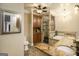 Elegant bathroom boasts a spacious shower, a jetted tub, granite countertops, and custom wood cabinets for ample storage at 110 Kylemore Pass, Tyrone, GA 30290