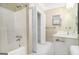 Functional bathroom with a shower-tub combo, large mirror, and a white vanity with ample storage space at 110 Kylemore Pass, Tyrone, GA 30290