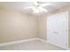 Cozy bedroom with neutral carpeting, a ceiling fan, and a closet with double doors at 110 Kylemore Pass, Tyrone, GA 30290