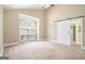 Large bedroom with a unique arched window, ceiling fan, and a sliding door at 110 Kylemore Pass, Tyrone, GA 30290